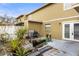 Patio with grill, seating area and small garden at 7606 Woodbridge Blvd, Tampa, FL 33615