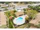 Kidney-shaped community pool with a covered patio nearby at 7606 Woodbridge Blvd, Tampa, FL 33615