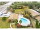 Community pool with surrounding landscaping and patio area at 7606 Woodbridge Blvd, Tampa, FL 33615