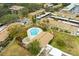 Aerial view of community pool and surrounding townhouses at 7606 Woodbridge Blvd, Tampa, FL 33615