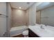 Bathroom with single vanity, tub, and tile flooring at 7849 Grafton Rd, North Port, FL 34291
