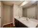 Double vanity bathroom with dark brown cabinets at 7849 Grafton Rd, North Port, FL 34291