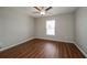 Simple bedroom with wood flooring and ceiling fan at 7849 Grafton Rd, North Port, FL 34291