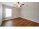 Simple bedroom with wood flooring and ceiling fan at 7849 Grafton Rd, North Port, FL 34291