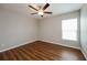 Simple bedroom with wood flooring and ceiling fan at 7849 Grafton Rd, North Port, FL 34291