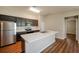 Modern kitchen with stainless steel appliances and an island at 7849 Grafton Rd, North Port, FL 34291
