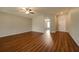 Spacious living room featuring hardwood floors and a ceiling fan at 7849 Grafton Rd, North Port, FL 34291
