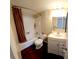 Clean bathroom with tub, shower, and updated vanity at 833 N Keene Rd # W12, Clearwater, FL 33755