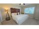 Main bedroom with king-size bed and decorative headboard at 833 N Keene Rd # W12, Clearwater, FL 33755