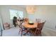 Dining room with round wooden table and chairs at 833 N Keene Rd # W12, Clearwater, FL 33755