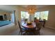 Dining room with round table and access to patio at 833 N Keene Rd # W12, Clearwater, FL 33755