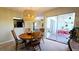 Dining room with round table and kitchen view at 833 N Keene Rd # W12, Clearwater, FL 33755