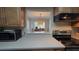 Kitchen features stainless steel appliances and light wood cabinets at 833 N Keene Rd # W12, Clearwater, FL 33755