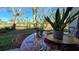 Relaxing patio with table and chairs, overlooking the yard at 833 N Keene Rd # W12, Clearwater, FL 33755