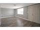 Bright living room with hardwood floors and neutral walls at 9005 Hunt Club Ln, Port Richey, FL 34668