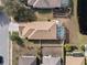 Overhead view showcasing home's layout, pool, and surrounding landscape at 9349 Creedmoor Ln, New Port Richey, FL 34654