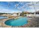 Screened pool with brick pavers and inflatable swans at 9349 Creedmoor Ln, New Port Richey, FL 34654