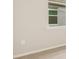 Simple bedroom with neutral walls and carpeting, featuring a window at 11498 Boundless Ter, Venice, FL 34293