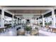 Large community bar with comfortable seating and views of the pool at 11498 Boundless Ter, Venice, FL 34293