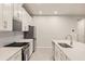 Sleek kitchen with stainless steel appliances and white cabinets at 11498 Boundless Ter, Venice, FL 34293