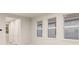 Living room with multiple windows and neutral color palette at 11498 Boundless Ter, Venice, FL 34293
