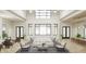 Spacious lobby with comfortable seating, high ceilings, and large windows at 11498 Boundless Ter, Venice, FL 34293