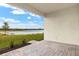 Relaxing patio overlooking a serene lake at 11498 Boundless Ter, Venice, FL 34293