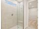 Large walk-in shower with neutral tile and glass enclosure at 11498 Boundless Ter, Venice, FL 34293