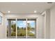 Stunning view of the backyard and pond from inside the house at 11498 Boundless Ter, Venice, FL 34293
