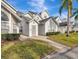 Exterior view of townhouse with walkway and landscaping at 12189 Armenia Gables Cir # 12189, Tampa, FL 33612