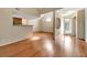 Open living room with hardwood floors and kitchen view at 12189 Armenia Gables Cir # 12189, Tampa, FL 33612