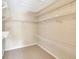 Large walk-in closet with wire shelving for storage at 12189 Armenia Gables Cir # 12189, Tampa, FL 33612