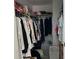 Walk in closet with double hanging rods at 12501 Ulmerton Rd # 64, Largo, FL 33774