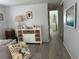 Bright hallway with white dresser and access to bathroom at 12501 Ulmerton Rd # 64, Largo, FL 33774