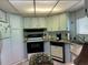 Galley kitchen with wood countertops and appliances at 12501 Ulmerton Rd # 64, Largo, FL 33774