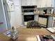 Galley kitchen with wood countertops and appliances at 12501 Ulmerton Rd # 64, Largo, FL 33774