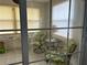 Bright sunroom with two comfy chairs and a small table at 12501 Ulmerton Rd # 64, Largo, FL 33774