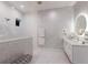 Stylish bathroom with a mosaic tiled wall, glass shower, and modern vanity at 1902 4Th E St, Palmetto, FL 34221