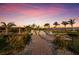 Charming outdoor area on the beach with tables and chairs and a beautiful sunset at 1902 4Th E St, Palmetto, FL 34221