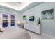 Serene bedroom featuring a comfortable seating area and sunset view at 1902 4Th E St, Palmetto, FL 34221