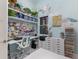Bright craft room featuring custom organization and floral wall design at 1902 4Th E St, Palmetto, FL 34221