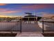 The private boat dock and lift provides direct access to the water for boating and fishing at 1902 4Th E St, Palmetto, FL 34221