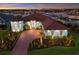 Stunning waterfront home with lush landscaping, brick drive, and serene sunset views overlooking the marina at 1902 4Th E St, Palmetto, FL 34221