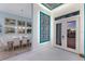 Elegant foyer with marble flooring, artistic wall accents, and a view into the adjacent dining area at 1902 4Th E St, Palmetto, FL 34221