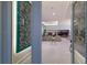 Inviting foyer with marble floors, artistic wall decor, and an open view into the spacious living area at 1902 4Th E St, Palmetto, FL 34221