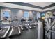 Community fitness center with modern cardio equipment, weight machines, and picturesque waterfront views at 1902 4Th E St, Palmetto, FL 34221