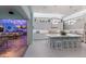 Modern kitchen with a large island, pendant lighting, and an adjacent bar area with water views at 1902 4Th E St, Palmetto, FL 34221