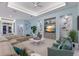 Comfortable living room with a large sectional sofa, recessed lighting, and a decorative wall unit at 1902 4Th E St, Palmetto, FL 34221