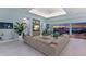 Beautiful living room featuring a large sectional sofa, ceiling fan, and a view of the water at 1902 4Th E St, Palmetto, FL 34221