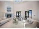 The community clubhouse lobby has elegant fireplace with tile surround, comfortable seating, and large windows at 1902 4Th E St, Palmetto, FL 34221